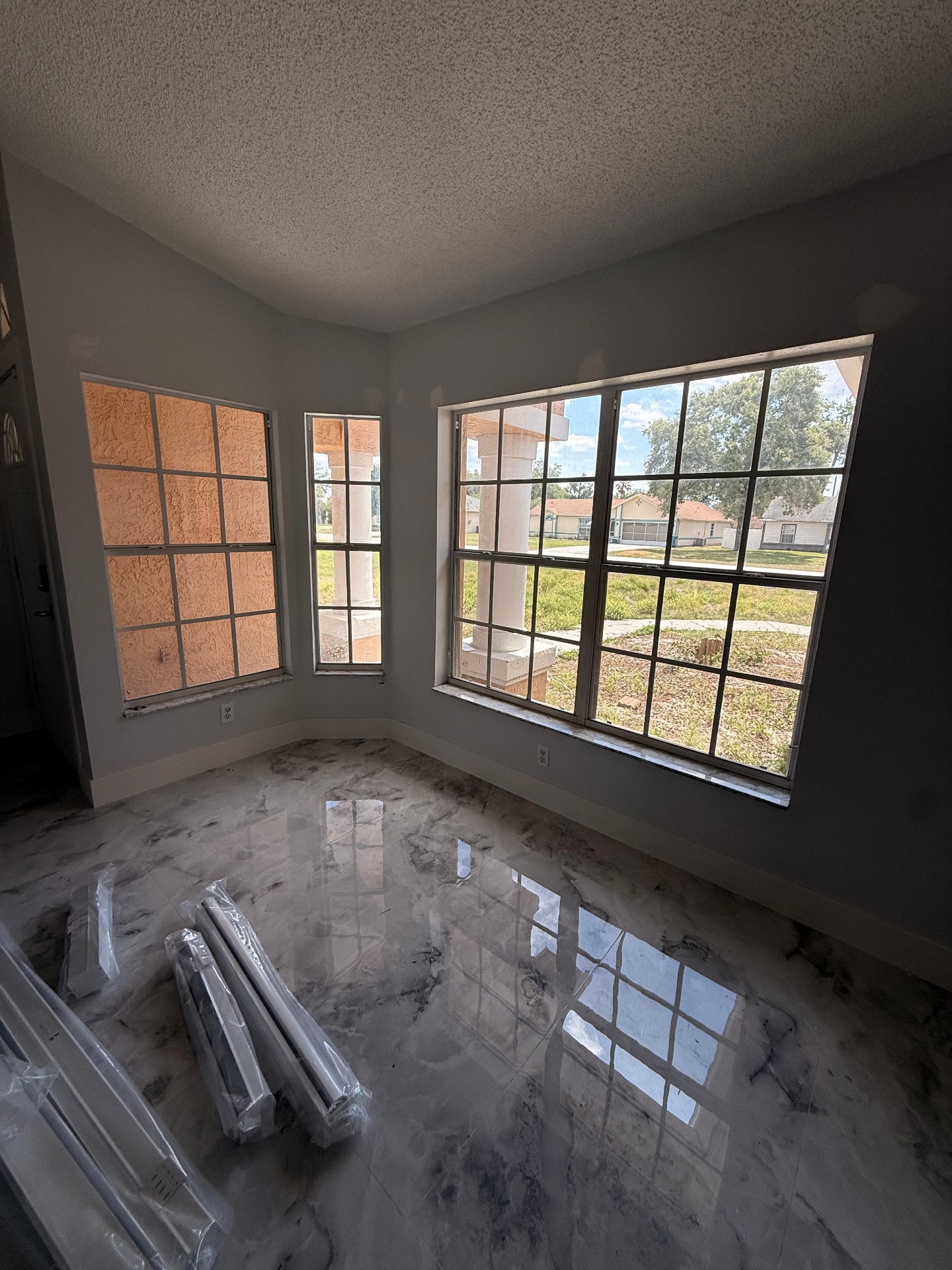 White roller shades on Florida home window